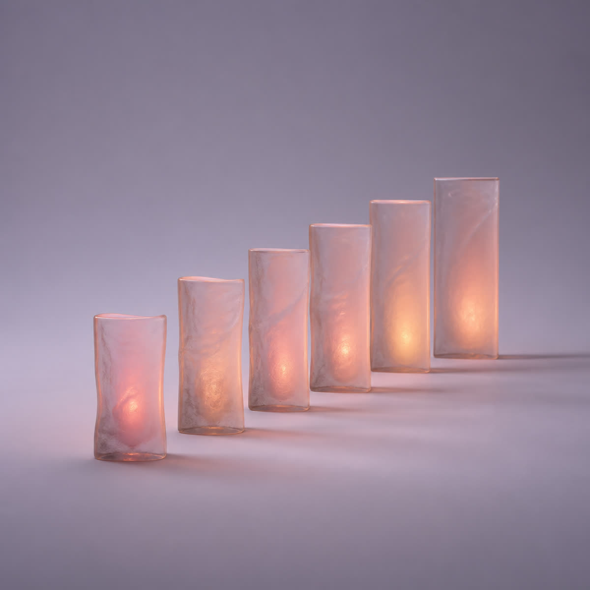 Glass panels set along a curving path, each glowing brighter than the last